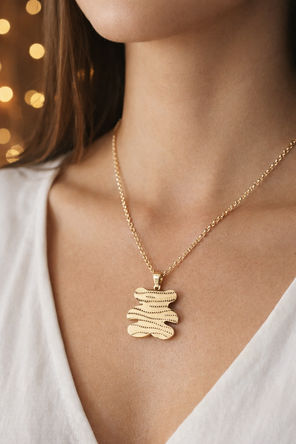 Halskette mit Anhänger – Goldener Wellenbär